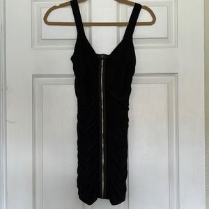 Black mini dress with zipper down the front.